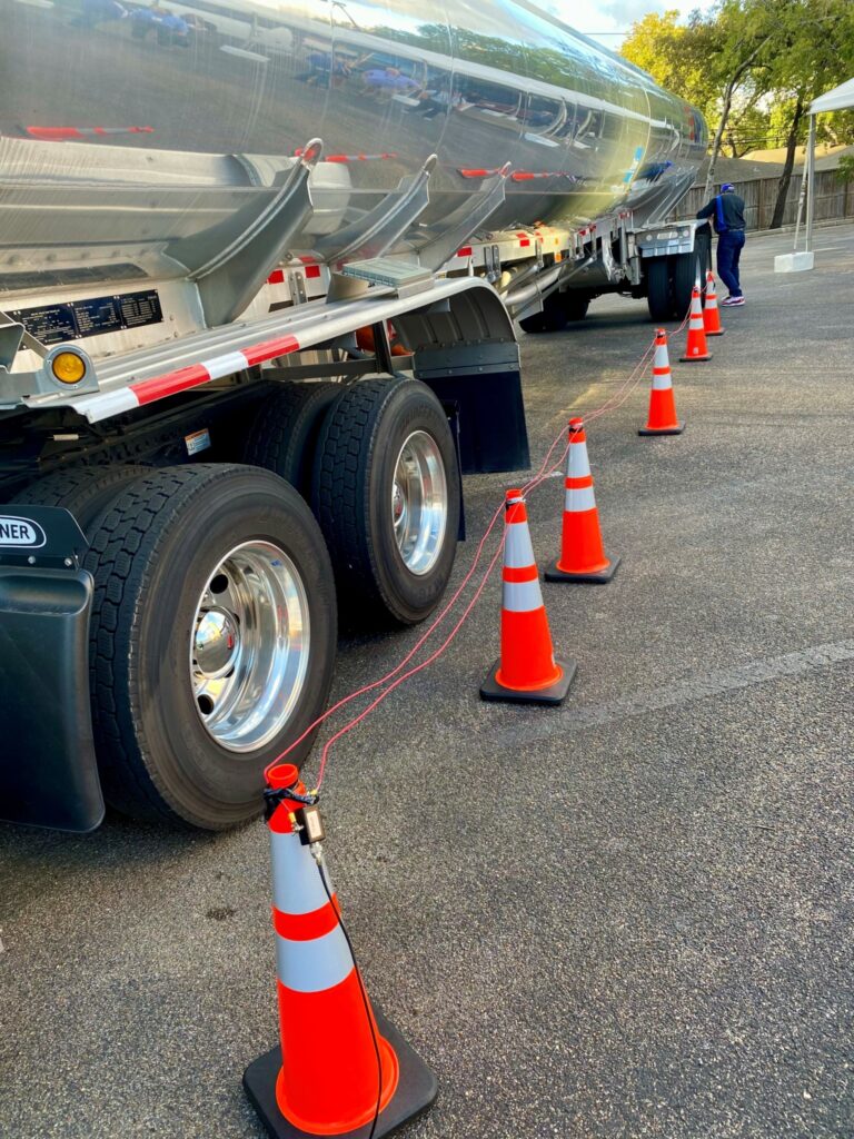 An antenna strung besides a tanker trailer