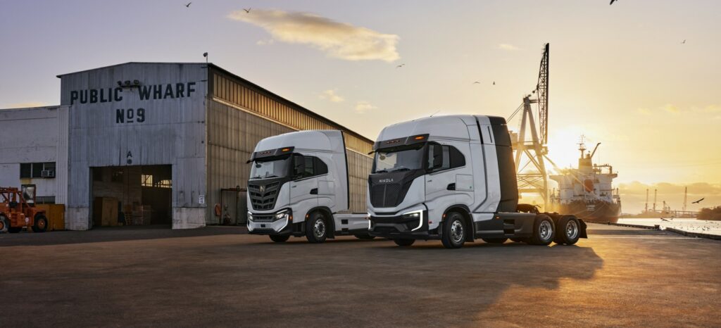 Nikola trucks parked on a wharf